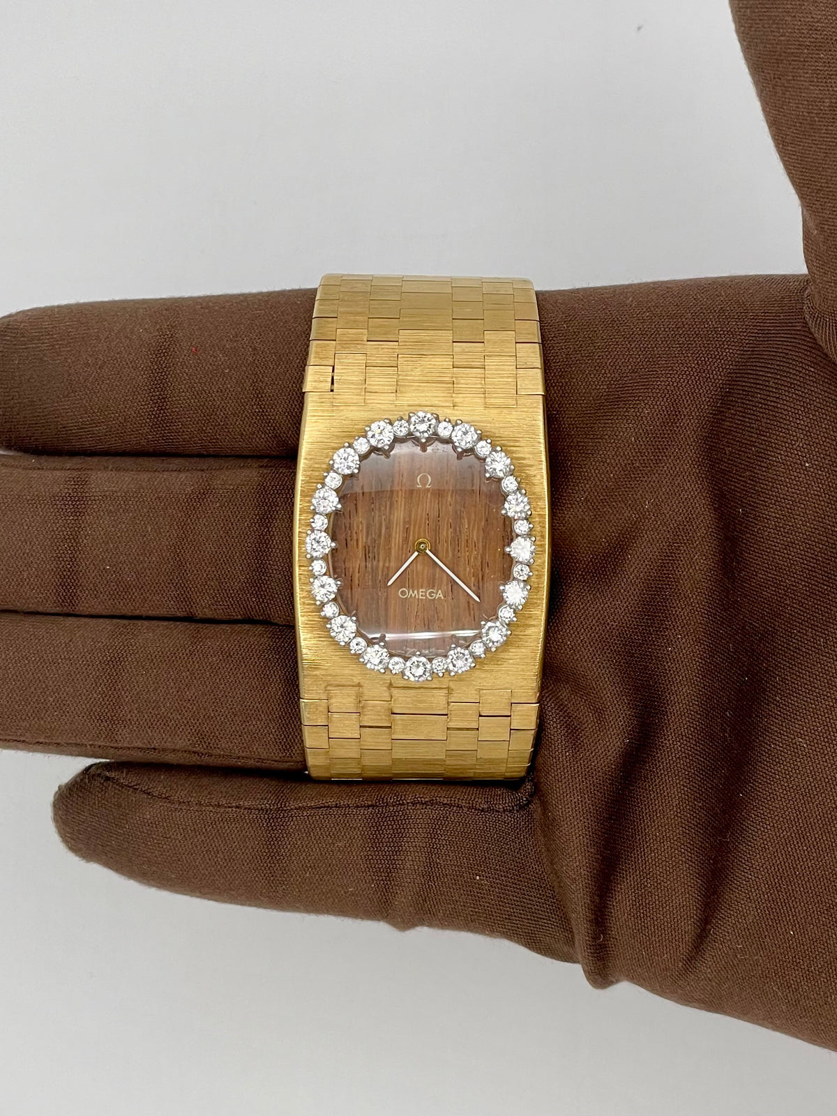 1970s Omega Wide 18kt Yellow Gold Diamond Bezel Teak Wood Dial
