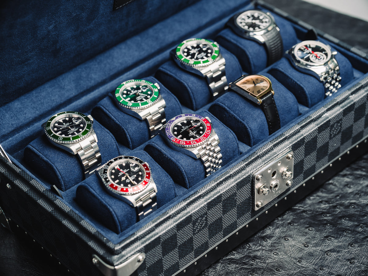 A case of Rolex sports watches at Reference in Time